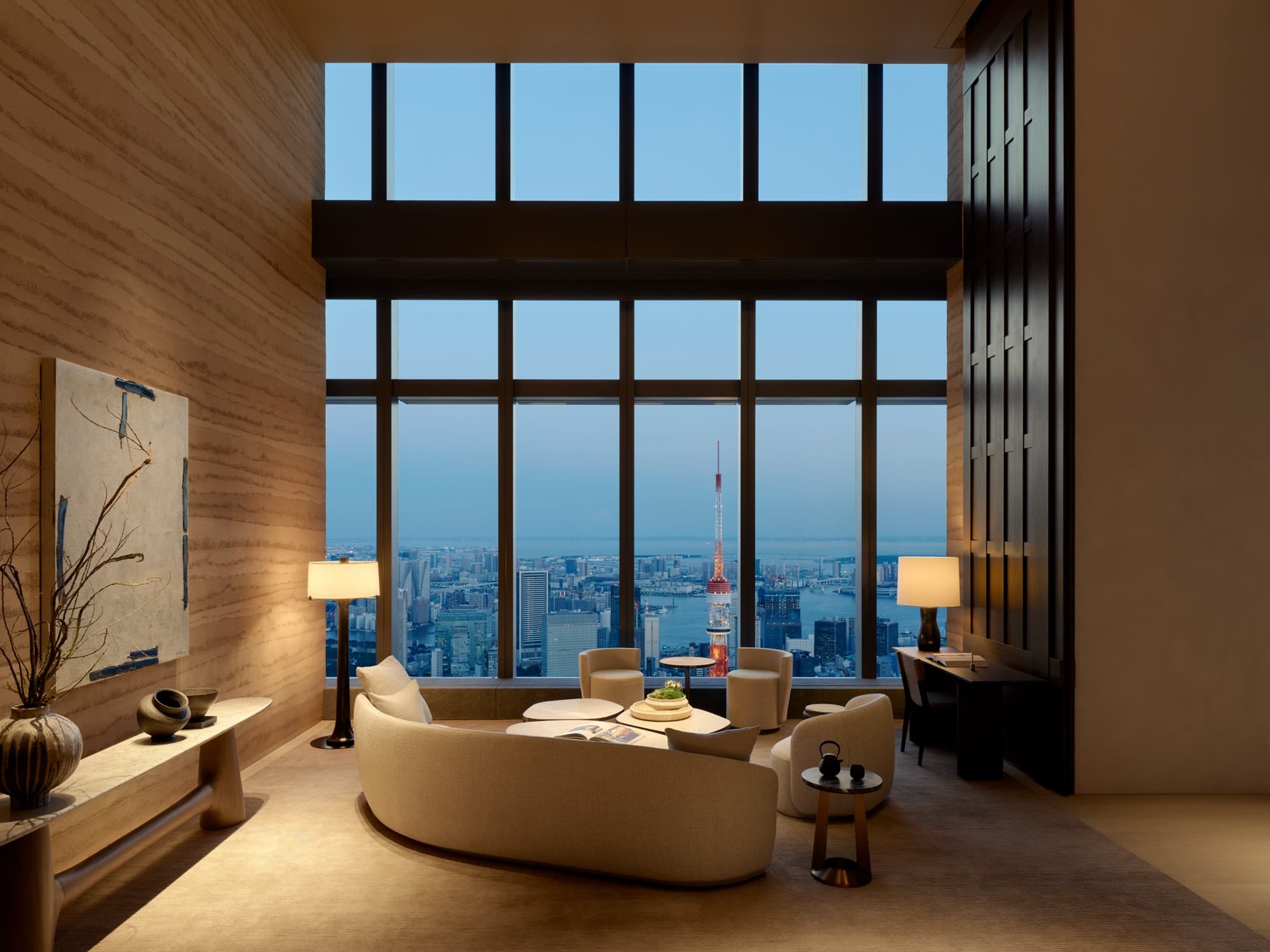 Double-height residents' lounge with Tokyo Tower beyond