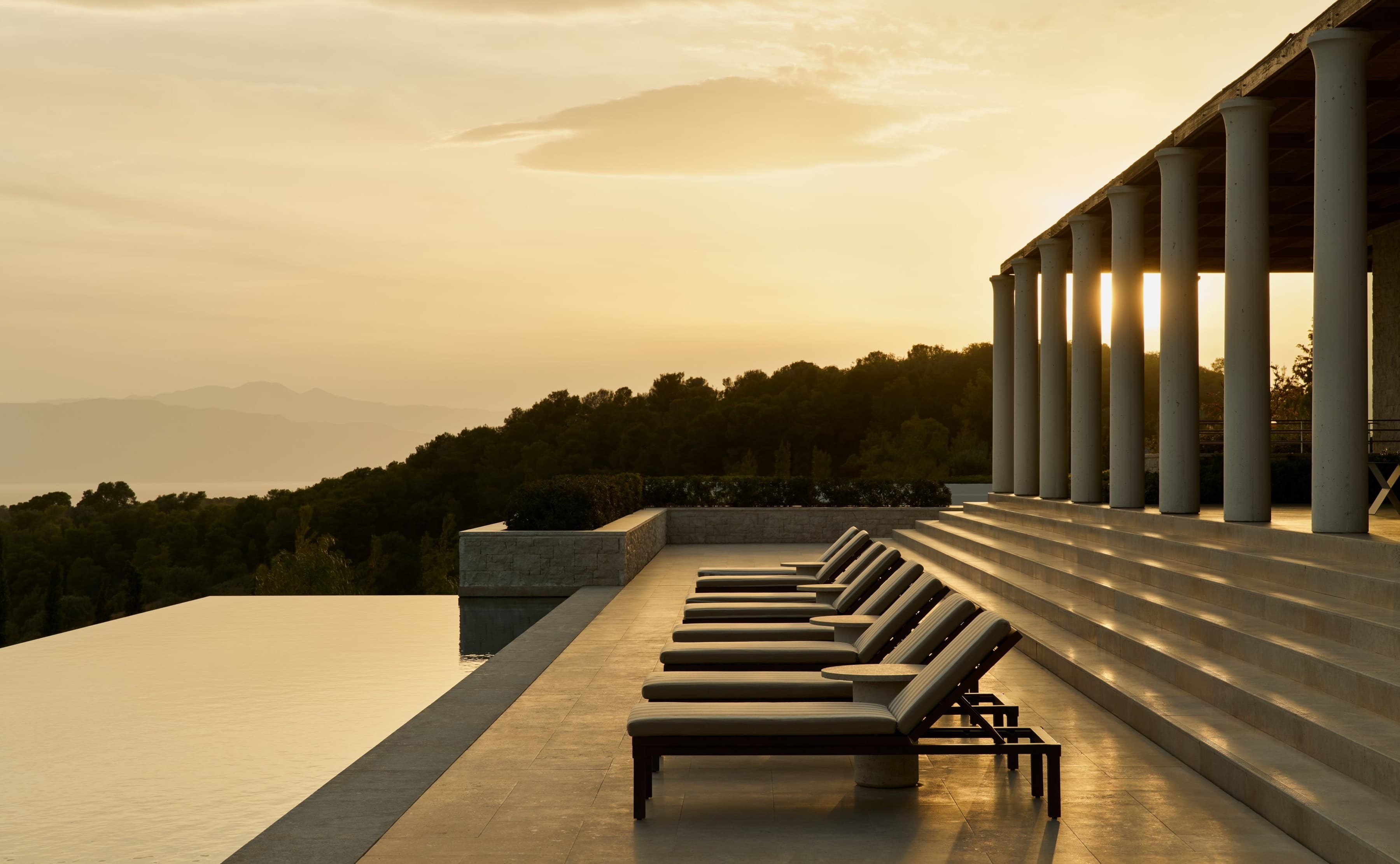 Villa pool terrace and colonnade at sunset