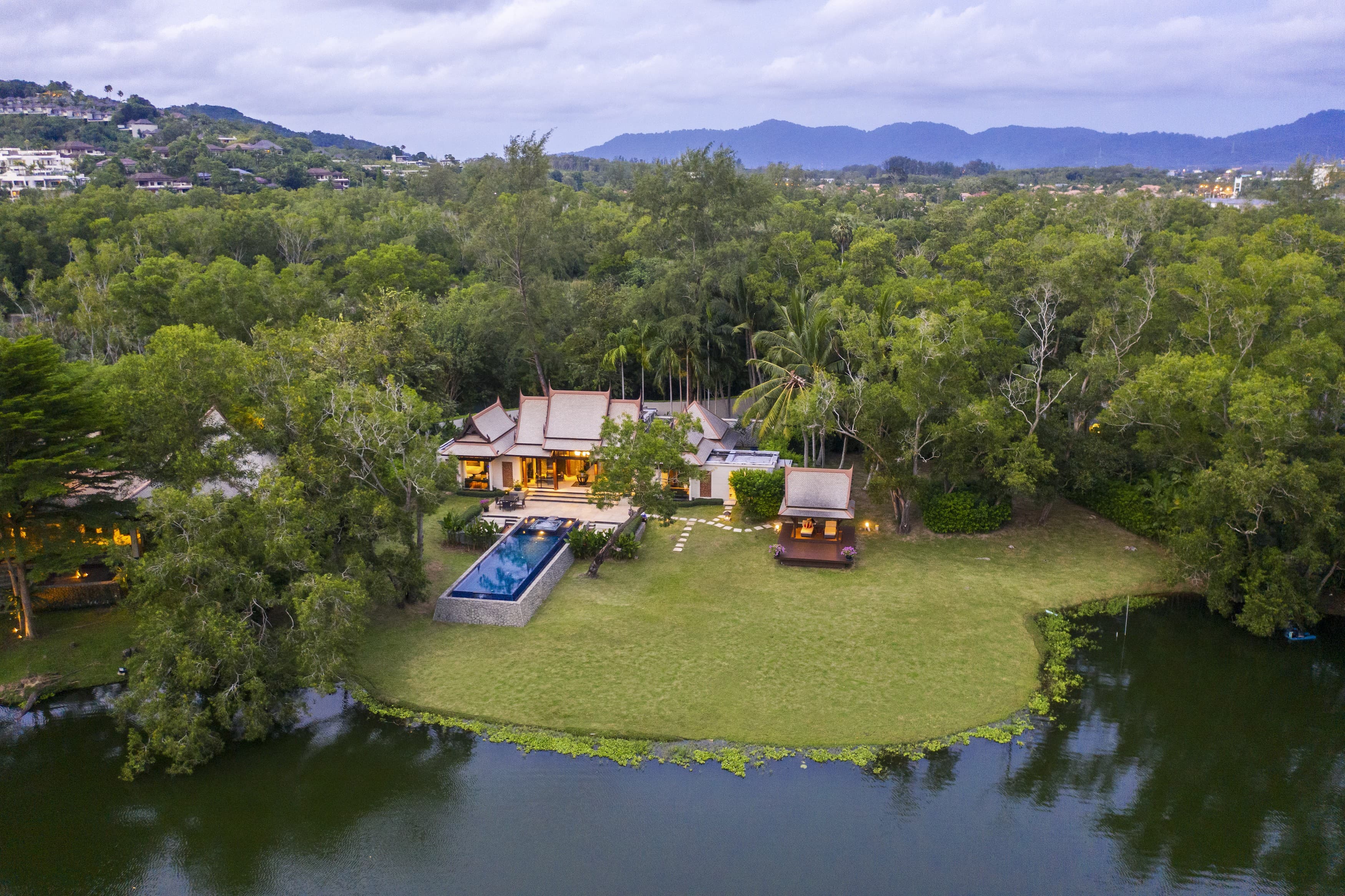 Two-bedroom DoublePool Villa beside the lagoon at dusk