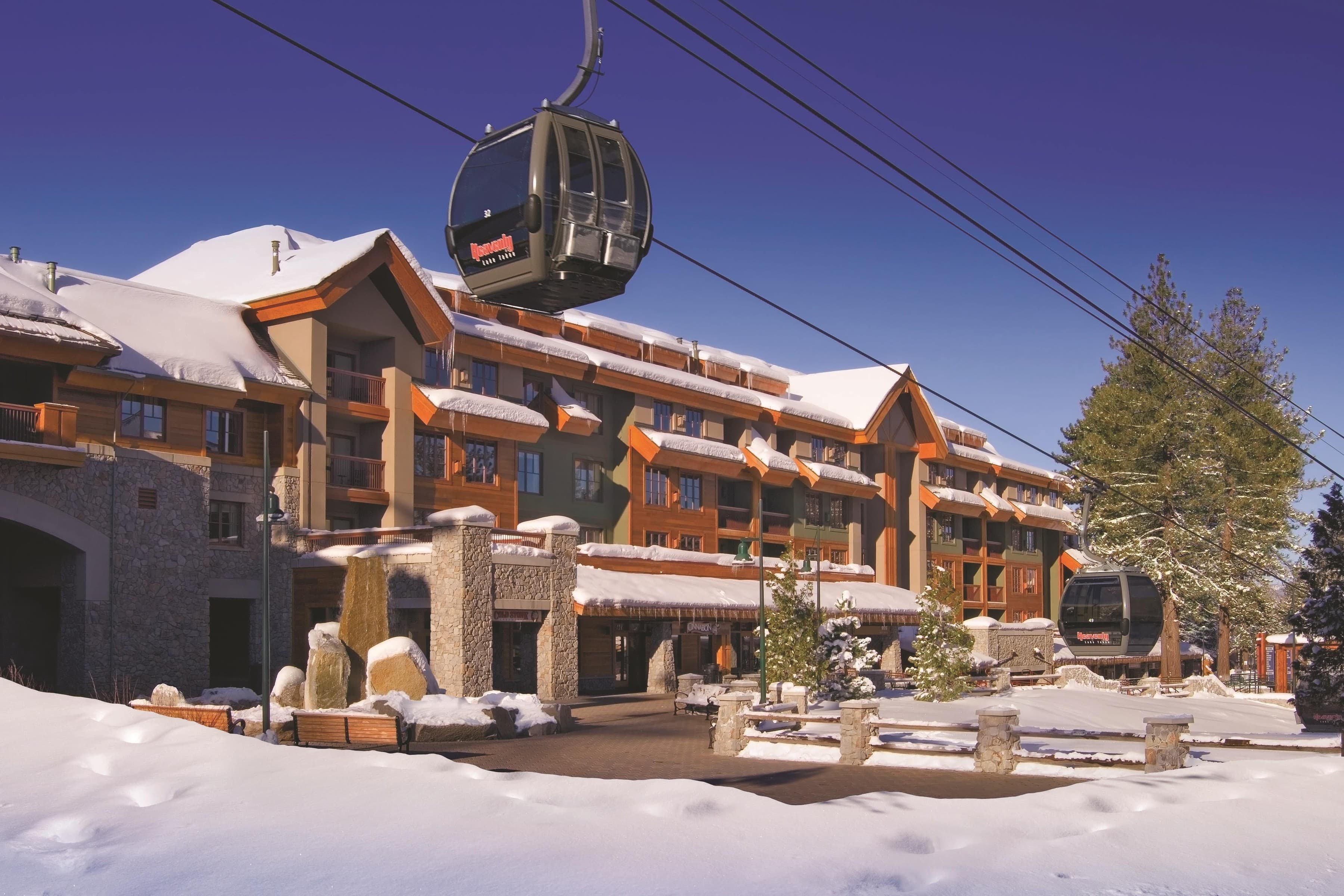 Resort exterior in snow with Heavenly gondola overhead