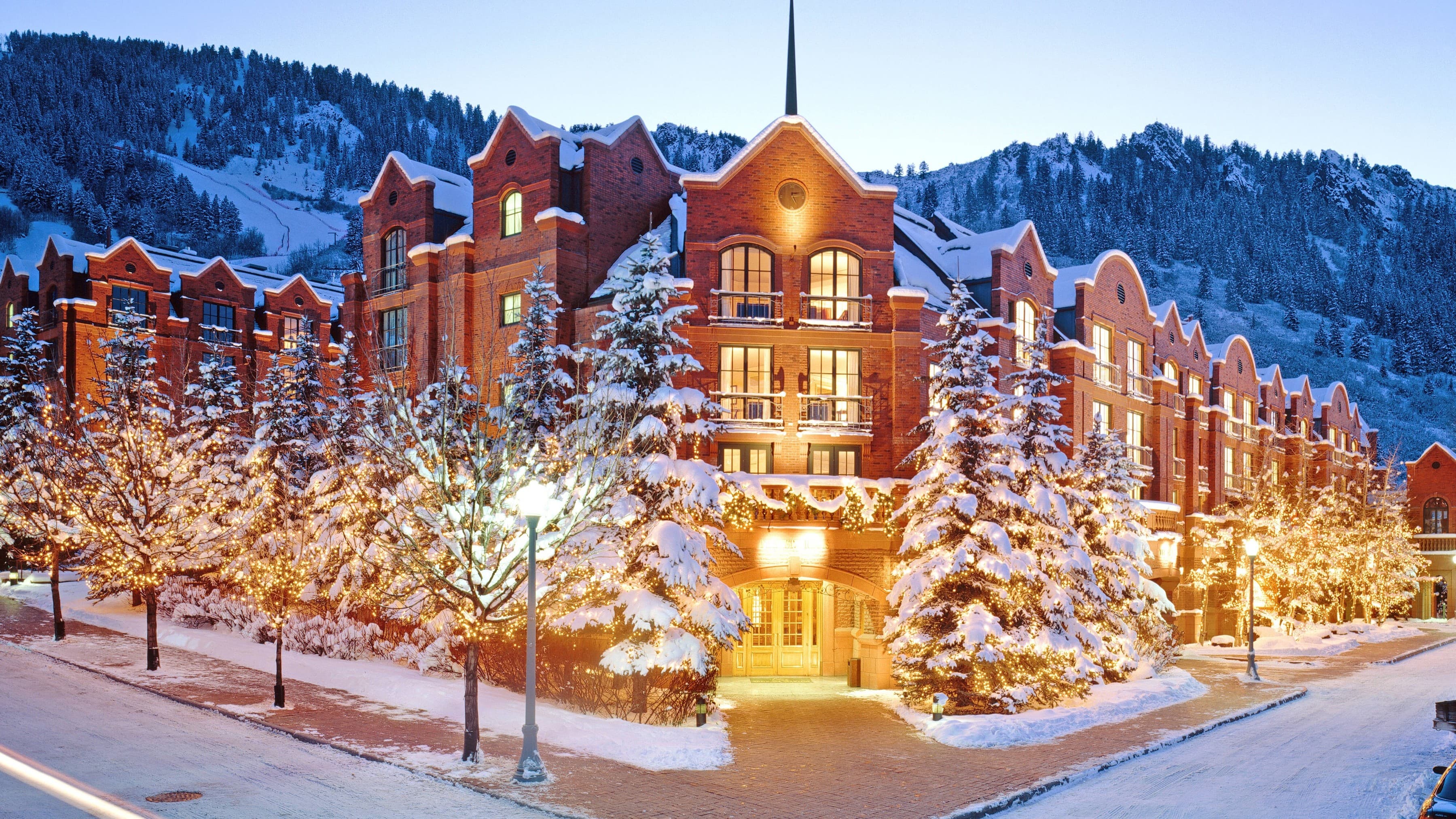 Resort exterior in snow at dusk